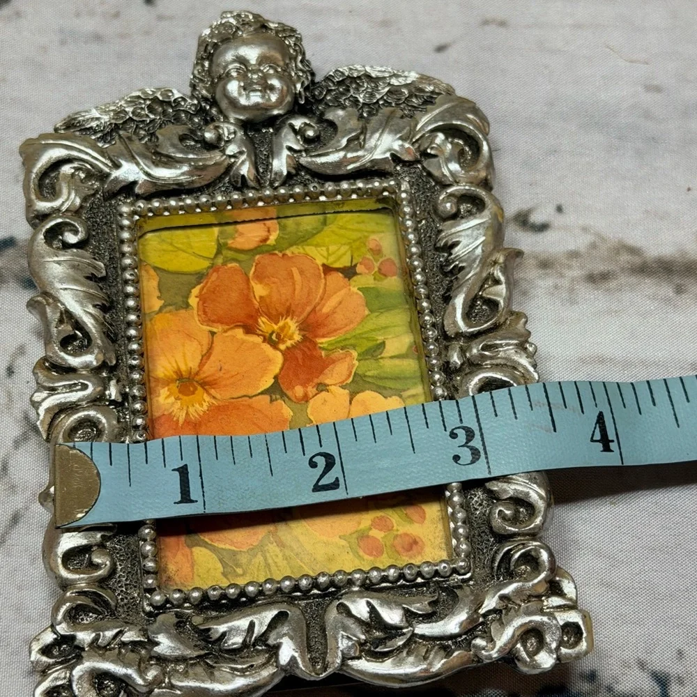 Ornate Silver Picture Frame with scrolling Art cherub detail 3x5”‎